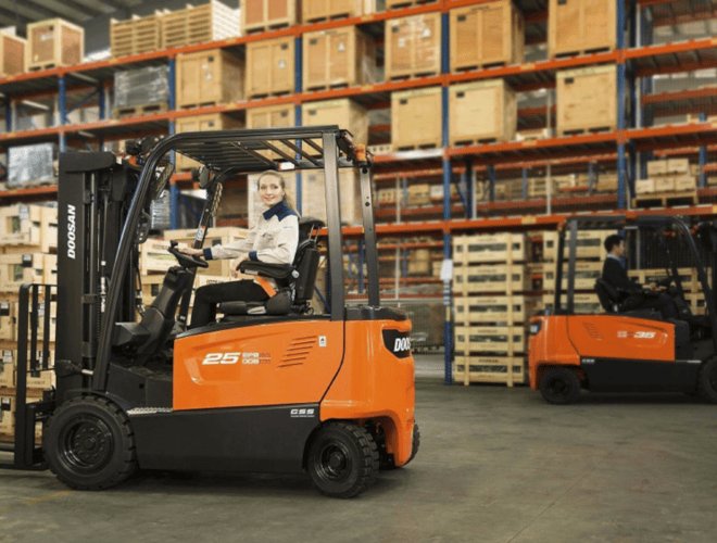 Woman operating Doosan forklift